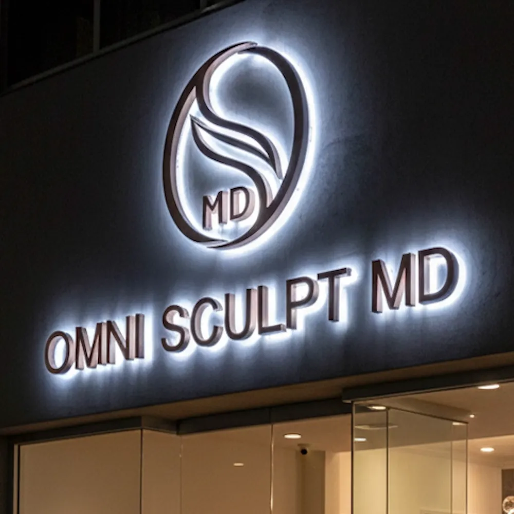 Large front-lit white 3D letters for "TWILSONS NEOBISTRO" on a workshop table, glowing with bright LED light.